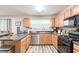 Well-lit kitchen with stainless steel appliances, lots of counter space, and modern finishes at 314 Meadows Ln, Canton, GA 30114
