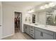 Bathroom features a double sink vanity and a door to a walk-in closet at 4724 Electric Sw Ave, Mableton, GA 30126
