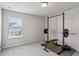 This bedroom includes a workout area and a window at 4724 Electric Sw Ave, Mableton, GA 30126