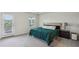 Bright bedroom featuring a large window, a comfy bed, and a door leading to the exterior at 4724 Electric Sw Ave, Mableton, GA 30126