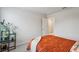 Bright bedroom with orange bedspread and black shelving at 4724 Electric Sw Ave, Mableton, GA 30126