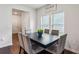 A lovely dining room with modern dark wood table and grey seating at 4724 Electric Sw Ave, Mableton, GA 30126