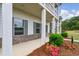 Charming home exterior featuring a stone foundation, neat landscaping, and a covered porch at 4724 Electric Sw Ave, Mableton, GA 30126