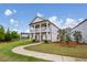 Beautifully landscaped home with a lush green lawn, colorful flowers, and a welcoming walkway at 4724 Electric Sw Ave, Mableton, GA 30126