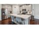Well-equipped kitchen featuring stainless steel appliances, a center island with bar seating, and a pantry at 4724 Electric Sw Ave, Mableton, GA 30126