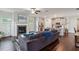Open-concept living room featuring a fireplace, ceiling fan, and hardwood floors at 4724 Electric Sw Ave, Mableton, GA 30126