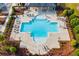 This aerial view shows the community pool and lounge chairs at 4724 Electric Sw Ave, Mableton, GA 30126