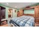 Basement bedroom featuring built-in cabinets, green walls, and access to an attached bathroom at 5170 Ridge Tarn, Acworth, GA 30102