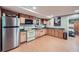 The basement kitchen features stainless steel appliances and wooden cabinets for cooking and entertaining at 5170 Ridge Tarn, Acworth, GA 30102