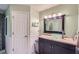Full bathroom with beadboard, a vessel sink, and a large mirror with updated lighting fixtures at 5170 Ridge Tarn, Acworth, GA 30102