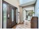 Inviting entryway featuring a decorative glass front door, hardwood floors, and views into the front room at 5170 Ridge Tarn, Acworth, GA 30102