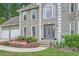 Charming two-story home with a well-manicured lawn, inviting entrance, and attached two car garage at 5170 Ridge Tarn, Acworth, GA 30102