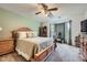 Spacious main bedroom with neutral paint, a ceiling fan, a king-sized bed, and lots of natural light at 5170 Ridge Tarn, Acworth, GA 30102