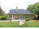 Spacious backyard featuring a patio, lush greenery, and manicured landscaping at 1720 Ivey Trce, Cumming, GA 30041