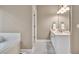 A clean bathroom with a white vanity, bright lighting, and a neutral color scheme at 1720 Ivey Trce, Cumming, GA 30041
