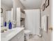 Well-lit bathroom with a shower and tub combo and essential storage at 1720 Ivey Trce, Cumming, GA 30041