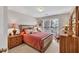 Cozy bedroom with natural light, carpeted floors, and a double-hung window view at 1720 Ivey Trce, Cumming, GA 30041