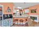 Bright kitchen featuring granite countertops, an island with seating, and stainless steel appliances at 1720 Ivey Trce, Cumming, GA 30041