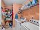 Functional laundry room with a washer, dryer, shelving, and plenty of storage space at 1720 Ivey Trce, Cumming, GA 30041