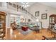 Spacious living room with a staircase, hardwood floors, and comfortable seating at 1720 Ivey Trce, Cumming, GA 30041