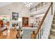 Cozy living room with a fireplace, staircase, and hardwood floors at 1720 Ivey Trce, Cumming, GA 30041