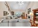 Bright living room featuring hardwood floors and a comfortable sectional sofa at 1720 Ivey Trce, Cumming, GA 30041