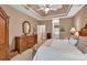 Spacious main bedroom features a trey ceiling, neutral colors, and beautiful, ornate furniture at 1720 Ivey Trce, Cumming, GA 30041