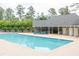 Sparkling community pool surrounded by a spacious sun deck and shaded lounge area at 1720 Ivey Trce, Cumming, GA 30041