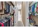 Spacious walk-in closet with ample hanging space and access to the primary bathroom at 1720 Ivey Trce, Cumming, GA 30041