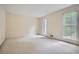 Neutral bedroom with large windows and plush carpet at 2034 Starfire Ne Dr, Atlanta, GA 30345