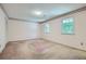Spacious bedroom with neutral walls, carpet flooring, and natural light at 2034 Starfire Ne Dr, Atlanta, GA 30345