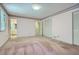 Bedroom with carpet flooring and multiple doorways, leading to bathroom and hall at 2034 Starfire Ne Dr, Atlanta, GA 30345