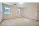 Bedroom featuring two windows and neutral carpet at 2034 Starfire Ne Dr, Atlanta, GA 30345