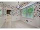 Bright breakfast nook featuring patterned wallpaper and views of the backyard at 2034 Starfire Ne Dr, Atlanta, GA 30345