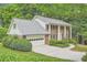 Brick home with a manicured lawn and mature trees at 2034 Starfire Ne Dr, Atlanta, GA 30345