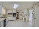 Functional kitchen with white cabinets, tile flooring, and traditional appliances at 2034 Starfire Ne Dr, Atlanta, GA 30345