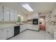 Well-lit kitchen features tiled floor, white cabinets and appliances at 2034 Starfire Ne Dr, Atlanta, GA 30345