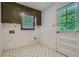 Small laundry room with overhead cabinets and access to the backyard at 2034 Starfire Ne Dr, Atlanta, GA 30345