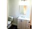 Cozy bathroom with modern vanity and fixtures, complemented by dark tile flooring at 3306 Chastain Ridge Dr, Marietta, GA 30066