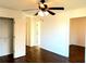 Bedroom with a ceiling fan, closet and open doorway to adjacent room at 3306 Chastain Ridge Dr, Marietta, GA 30066