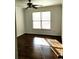 Sunlit bedroom featuring a ceiling fan and large window providing ample natural light at 3306 Chastain Ridge Dr, Marietta, GA 30066