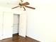 Bright bedroom with a ceiling fan and closet featuring built-in shelving for optimal storage at 3306 Chastain Ridge Dr, Marietta, GA 30066