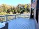 Private outdoor deck with wood flooring overlooks the backyard and wooded area at 3306 Chastain Ridge Dr, Marietta, GA 30066