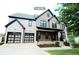 Two-story house features a two-car garage and a well-maintained lawn at 3306 Chastain Ridge Dr, Marietta, GA 30066