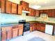 Traditional kitchen with wooden cabinets, stainless steel appliances, decorative tile backsplash, and granite countertop at 3306 Chastain Ridge Dr, Marietta, GA 30066