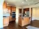 Well-equipped kitchen with wood cabinetry, granite counters, stainless steel appliances, and central island at 3306 Chastain Ridge Dr, Marietta, GA 30066