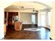 Open-concept living space showcasing hardwood floors, a kitchen island, and natural light at 3306 Chastain Ridge Dr, Marietta, GA 30066