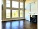Bright living room featuring a fireplace, hardwood floors, and large windows with abundant natural light at 3306 Chastain Ridge Dr, Marietta, GA 30066