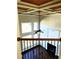 Upstairs view to living room with fireplace, soaring ceiling, and large windows for natural light at 3306 Chastain Ridge Dr, Marietta, GA 30066