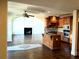 Open layout with a spacious kitchen, island, stainless appliances, and living room with fireplace at 3306 Chastain Ridge Dr, Marietta, GA 30066